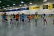 A hockey rink full of kids kicking off a summer program, aimed at teaching lifelong healthy habits, by doing a Zumba workout.